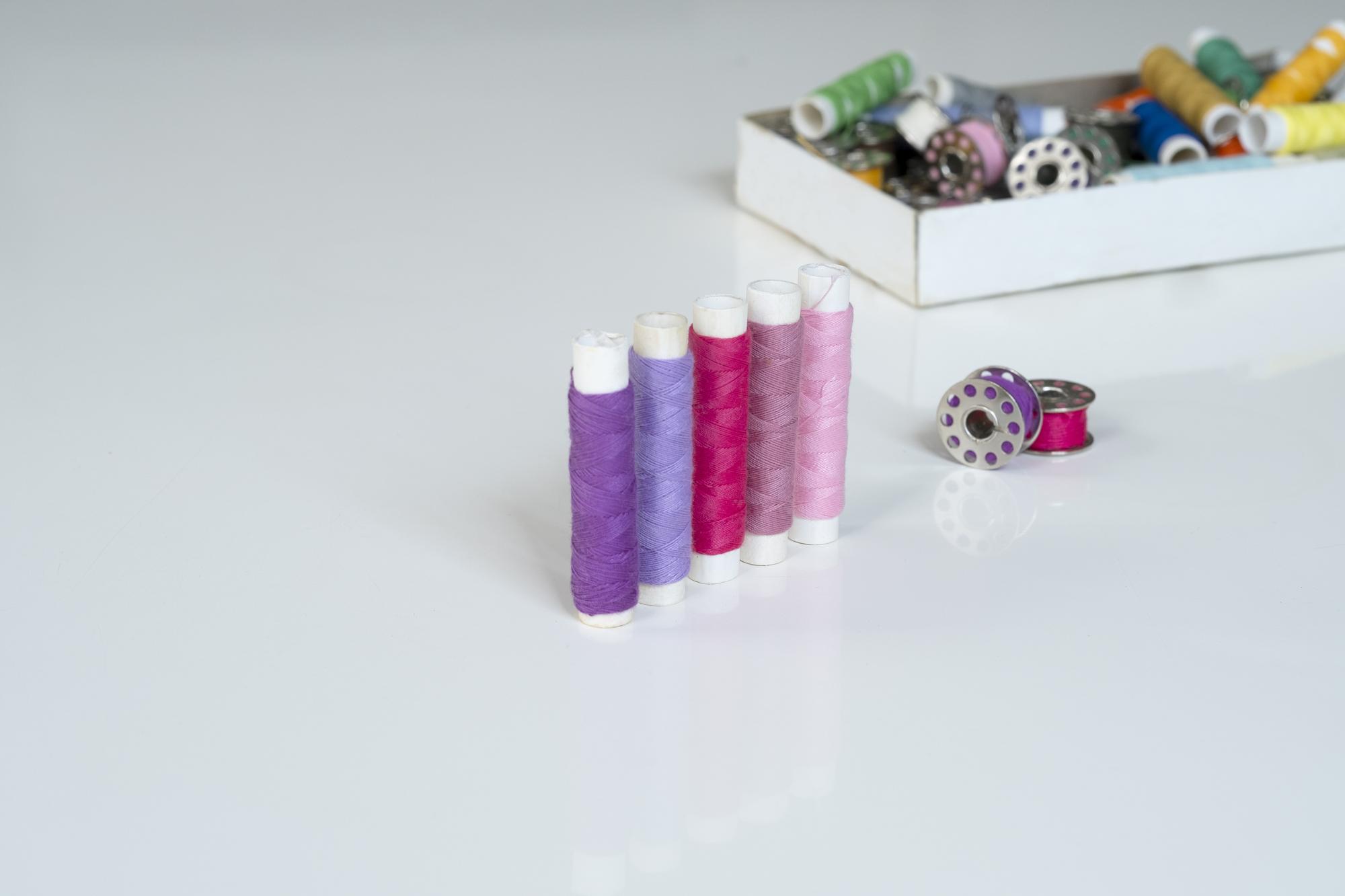 Selection of finished embroidered products on table